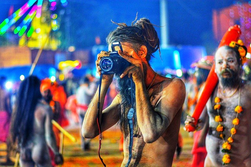 A Naga Sadhu Using A DSLR