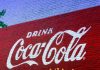 37 Interesting Facts About Coca-Cola A wall paint advertisement of Coca-Cola