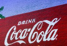 37 Interesting Facts About Coca-Cola A wall paint advertisement of Coca-Cola